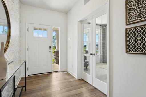 (Photo of decorated model, actual home's finishes will vary) The foyer and flex space have windows that provide more natural light