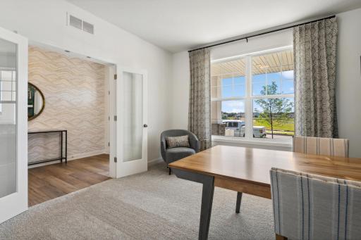(Photo of decorated model, actual home's finishes will vary) Perfect for an office space or recreation room, this flex space is well-suited for the unique needs of any homeowner.