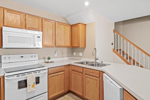 Freshly painted kitchen with lots of storage.