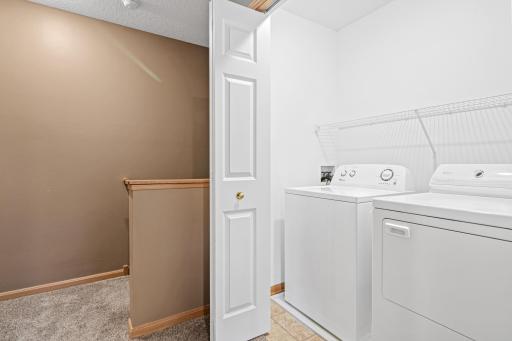 Laundry conveniently located on the upper level