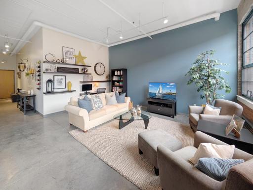 This living room is primed for your creativity to decorate it to perfection.
