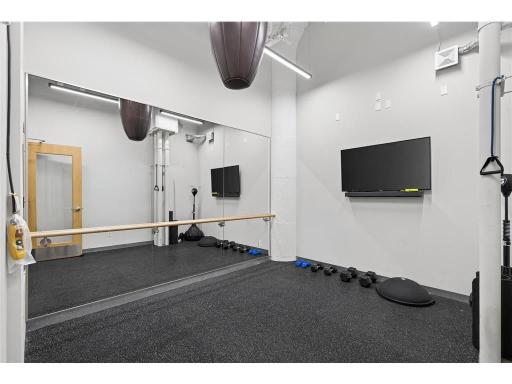 Second fitness center with weights, punching bag, and barre!