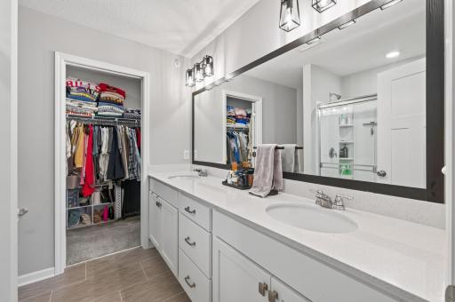 Private Primary Bath Features Lots of Storage, Lighting and Double Sinks