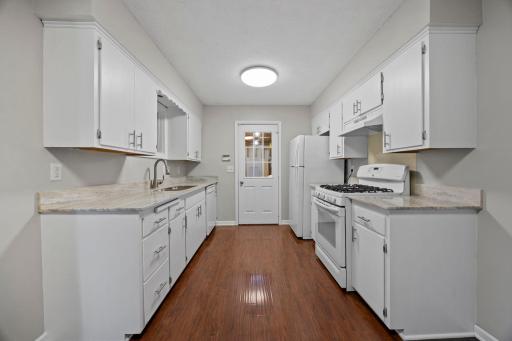 Kitchen also has a window overlooking the backyard and sunroom