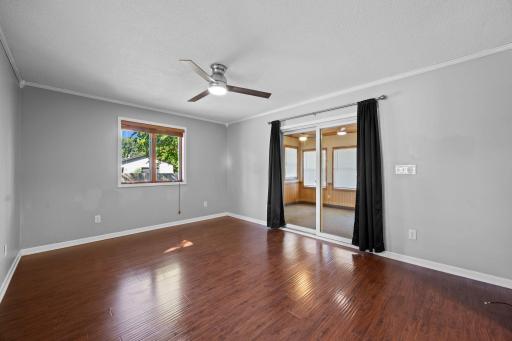 Main level family room leads to the sunroom