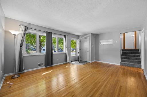 Beautiful South facing living room with original hardwood floors and great natural light