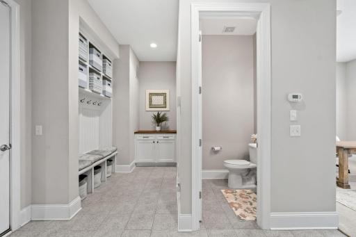 oversized Mudroom w/ built-in cubbies + drop station