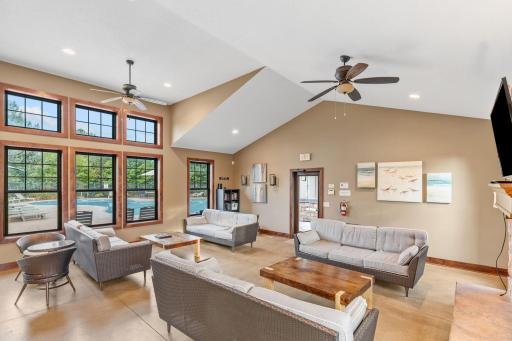 Clubhouse w/ full kitchen, fireplace, TV, bathroom & multiple entertaining spaces.