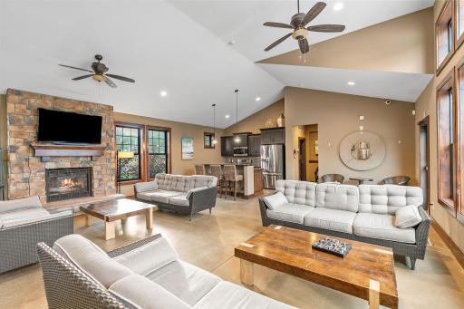 Clubhouse w/ full kitchen, fireplace, TV, bathroom & multiple entertaining spaces.