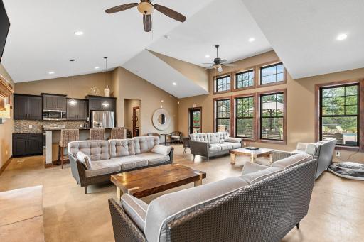Clubhouse w/ full kitchen, fireplace, TV, bathroom & multiple entertaining spaces.