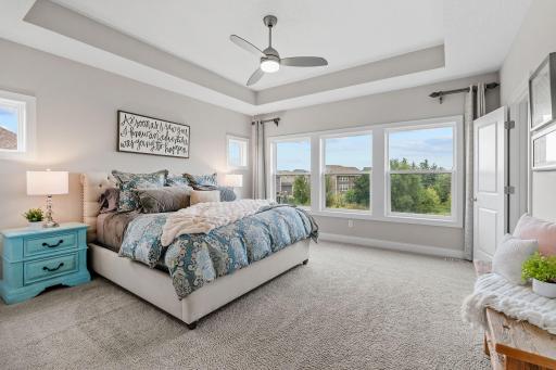 Primary Suite w/ dual walk-in closets + oversized tiled Serenity Shower
