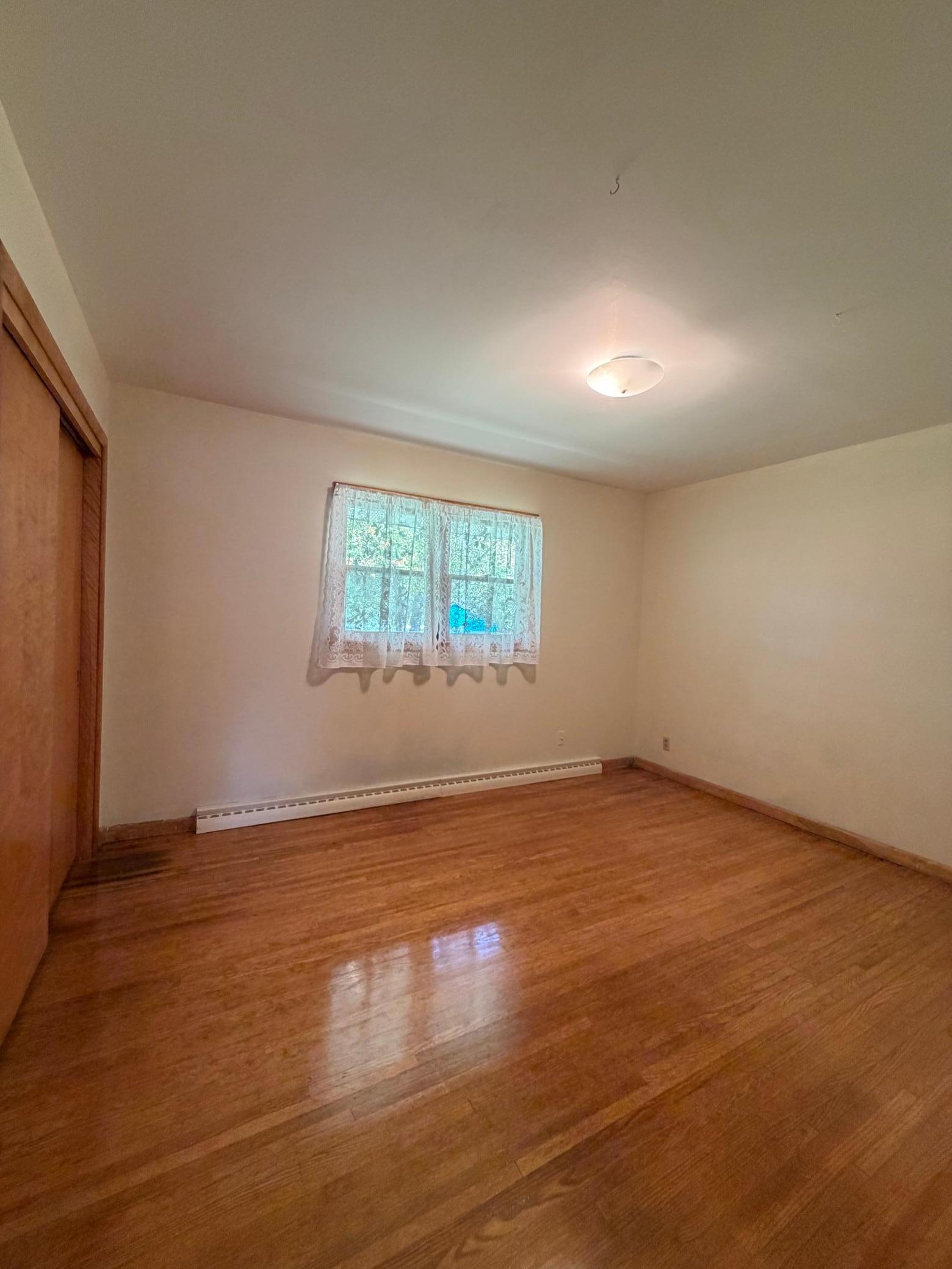 refurbished wood floors in bedroom