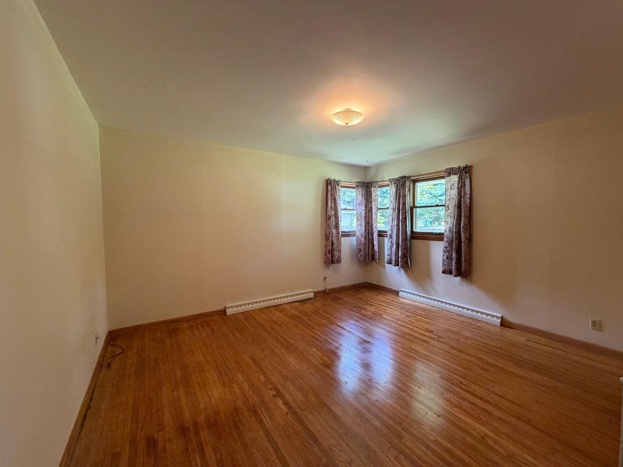 2nd bedroom with original refurbished wood floors