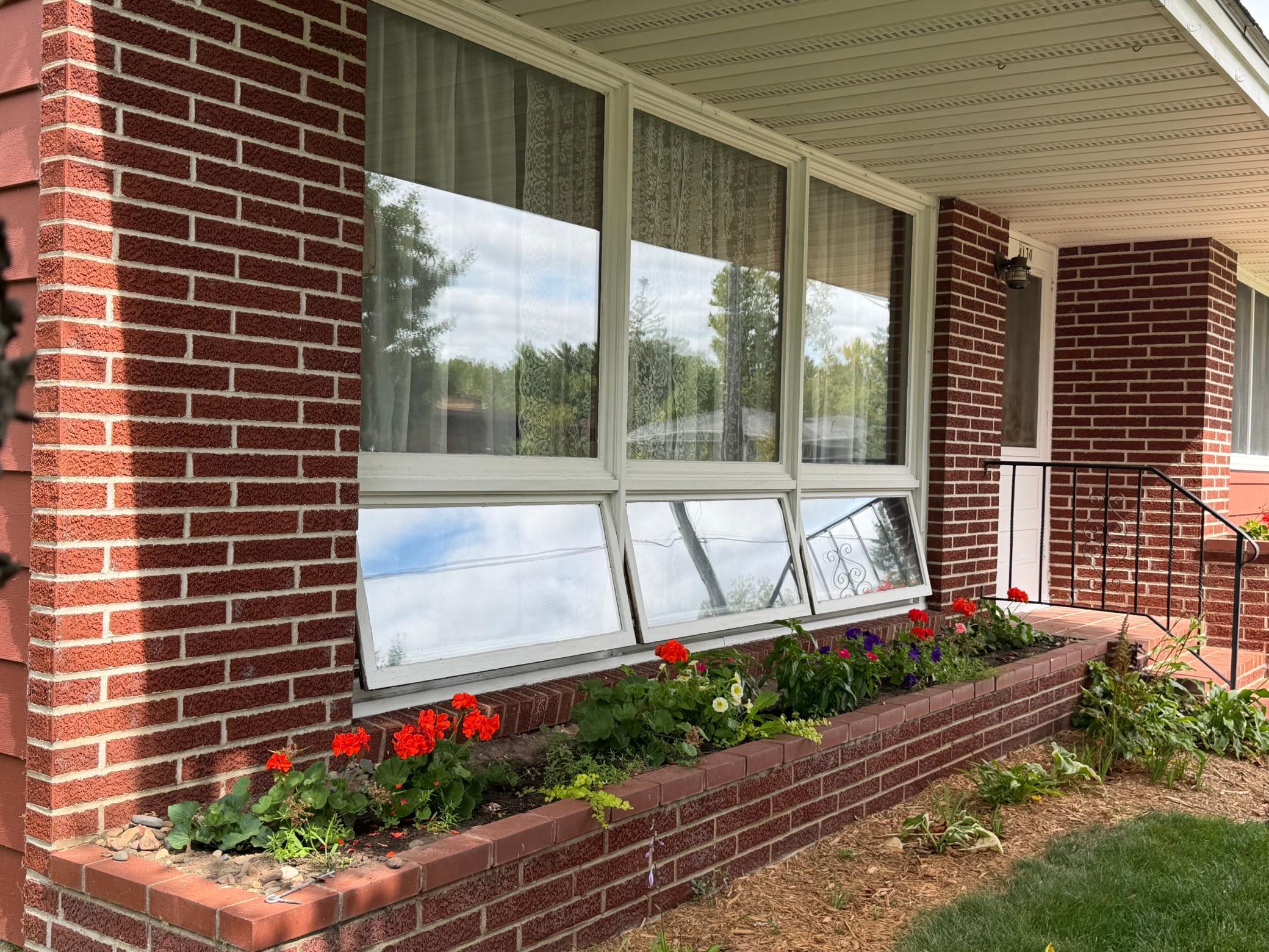 Beautiful front of home with built in flower beds