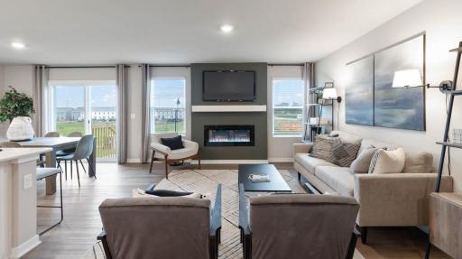 Harmony Living room with two bright windows next to glass sliding doors. Photos are of similar staged home. Colors and options may vary. Ask Sales Agent for details.