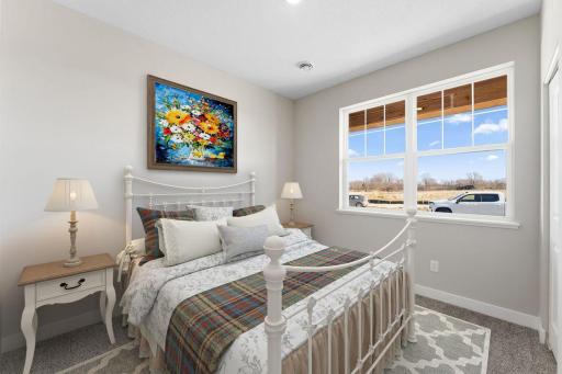 Harmony Bedroom 2. Photos are of similar staged home. Colors and options may vary. Ask Sales Agent for details.