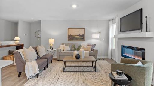 Cozy living room space open view from kitchen. Photos are of similar staged home. Colors and options may vary. Ask Sales Agent for details.