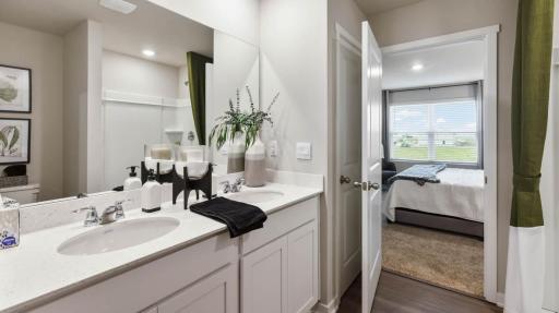 Harmony Large primary bedroom with double sinks. Photos are of similar staged home. Colors and options may vary. Ask Sales Agent for details.