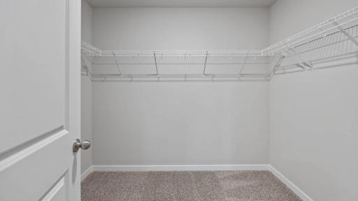 Large walk in closet. Photos are of similar staged home. Colors and options may vary. Ask Sales Agent for details.