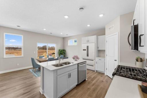 Harmony Main Floor. Photos are of similar staged home. Colors and options may vary. Ask Sales Agent for details.