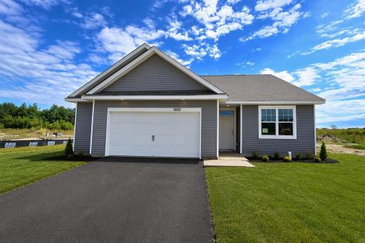 The Harmony shown with a 2-1/2 car garage at Highlands at Eagle View in Elko New Market. Photo is of similar home. Options and colors may vary. Ask Sales Agent for details. AI-generated landscaping for visualization. Actual yard condition may differ.