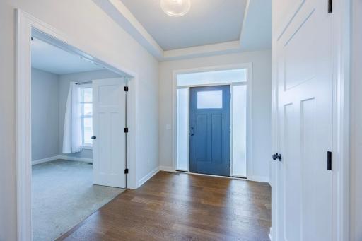 A private office is conveniently located to the right of the entryway