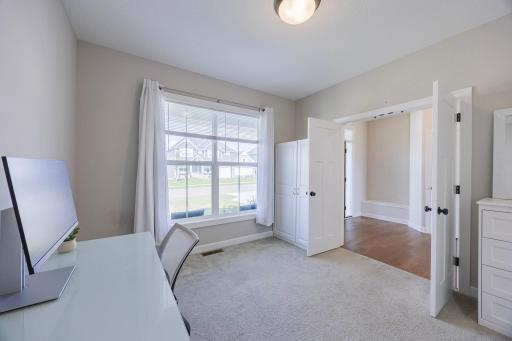 A private office is conveniently located to the right of the entryway