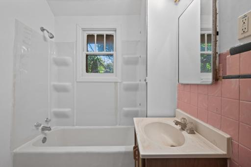 A full bathroom conveniently located near both main-level bedrooms.