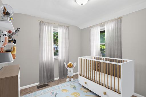 Two bedrooms on the main level offer flexibility for sleeping space, an office, nursery, or guest room.