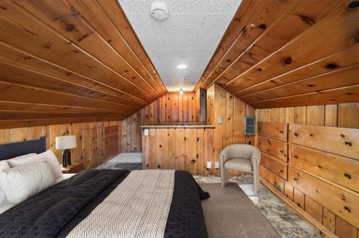 The spacious upper level offers a surprisingly large bedroom with room to create a private retreat.