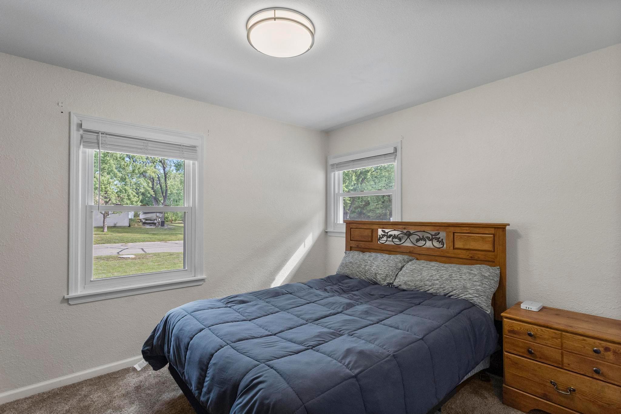 Beautifully lit 2nd bedroom located towards the front of the home