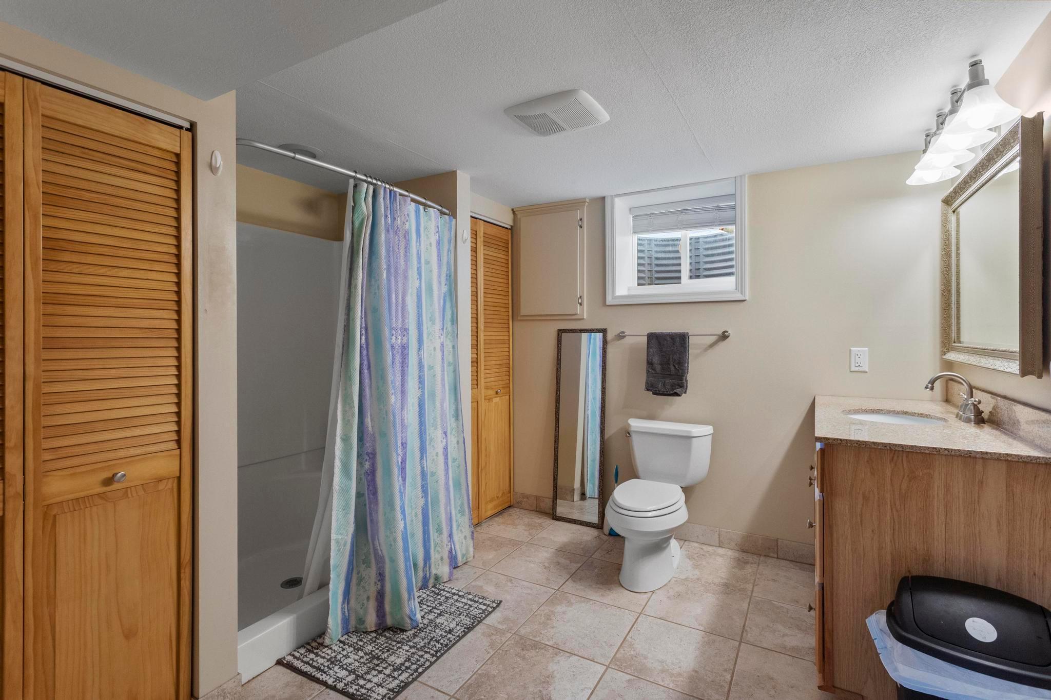 Attached to downstairs bedroom, enjoy a spacious downstairs 3/4 bath with walk-in shower
