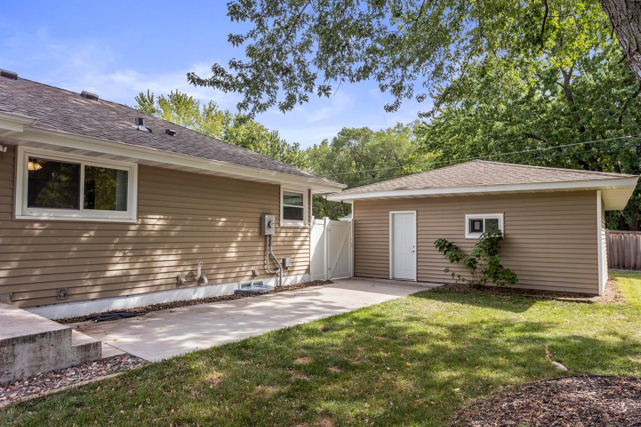 Concrete patio/walk up for easy access from detached garage to back door/kitchen