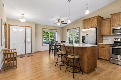 Kitchen connects to large, well-lit dining space