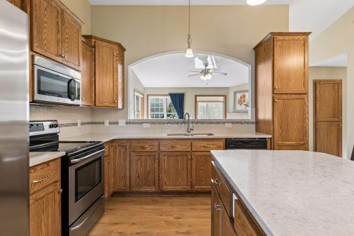 Sink overlooks main living area and gets light from multiple sides