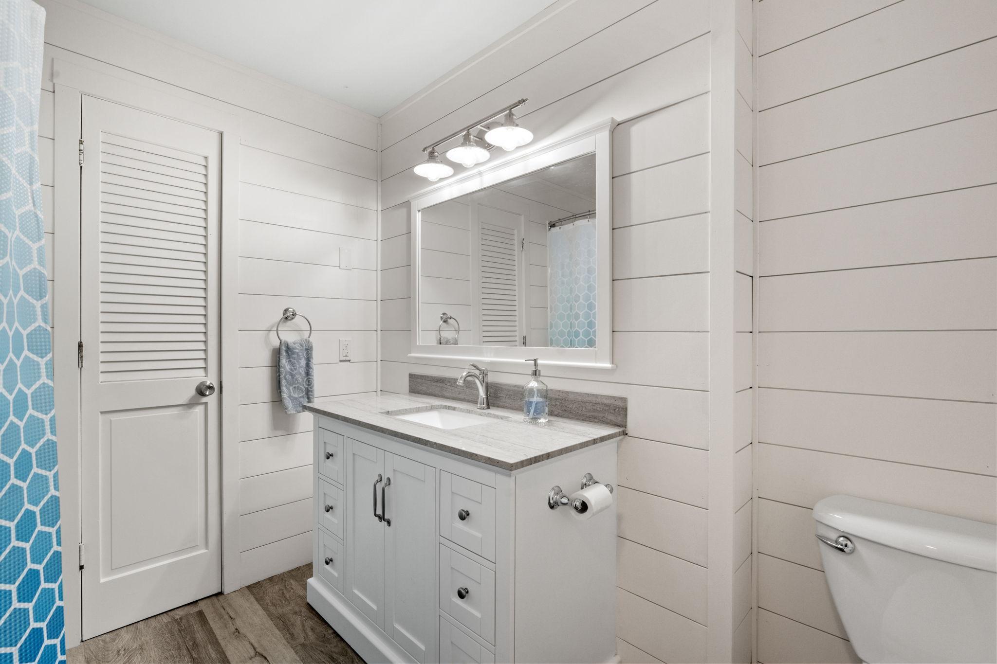 Full bathroom with quartz vanity
