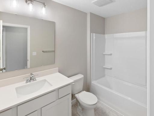 PHOTO OF A DIFFERENT HOME WITH SIMILAR PLAN & FINISHES. Plan and finishes may vary. Upper Floor Full Bathroom.