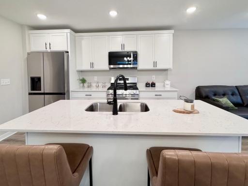 7077 Kittredge Ln NE- Kitchen features a spacious center island.