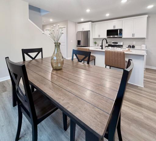 7077 Kittredge Lane NE - Photo of actual completed home. Dining Room open to kitchen.