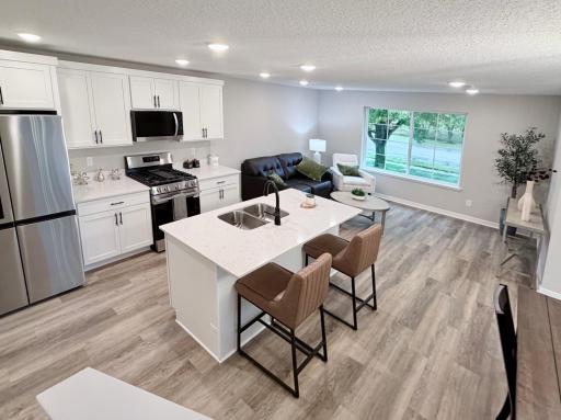 7077 Kittredge Lane NE - Photo of actual completed home lightly staged with furniture.