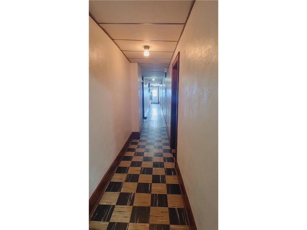 Central Common Corridor with Classic Checkered Tile Flooring