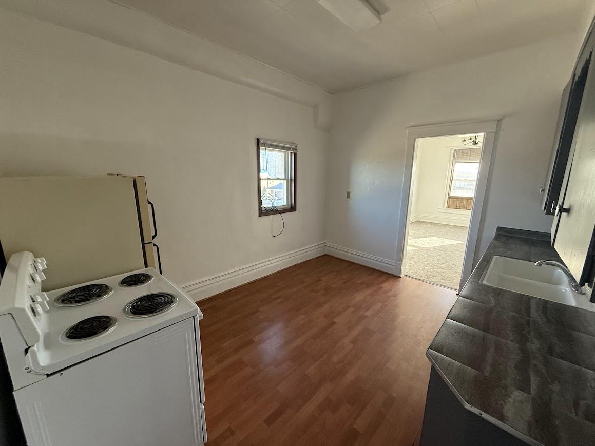 Unit 5: Spacious Kitchen Layout with Laminate Wood Flooring