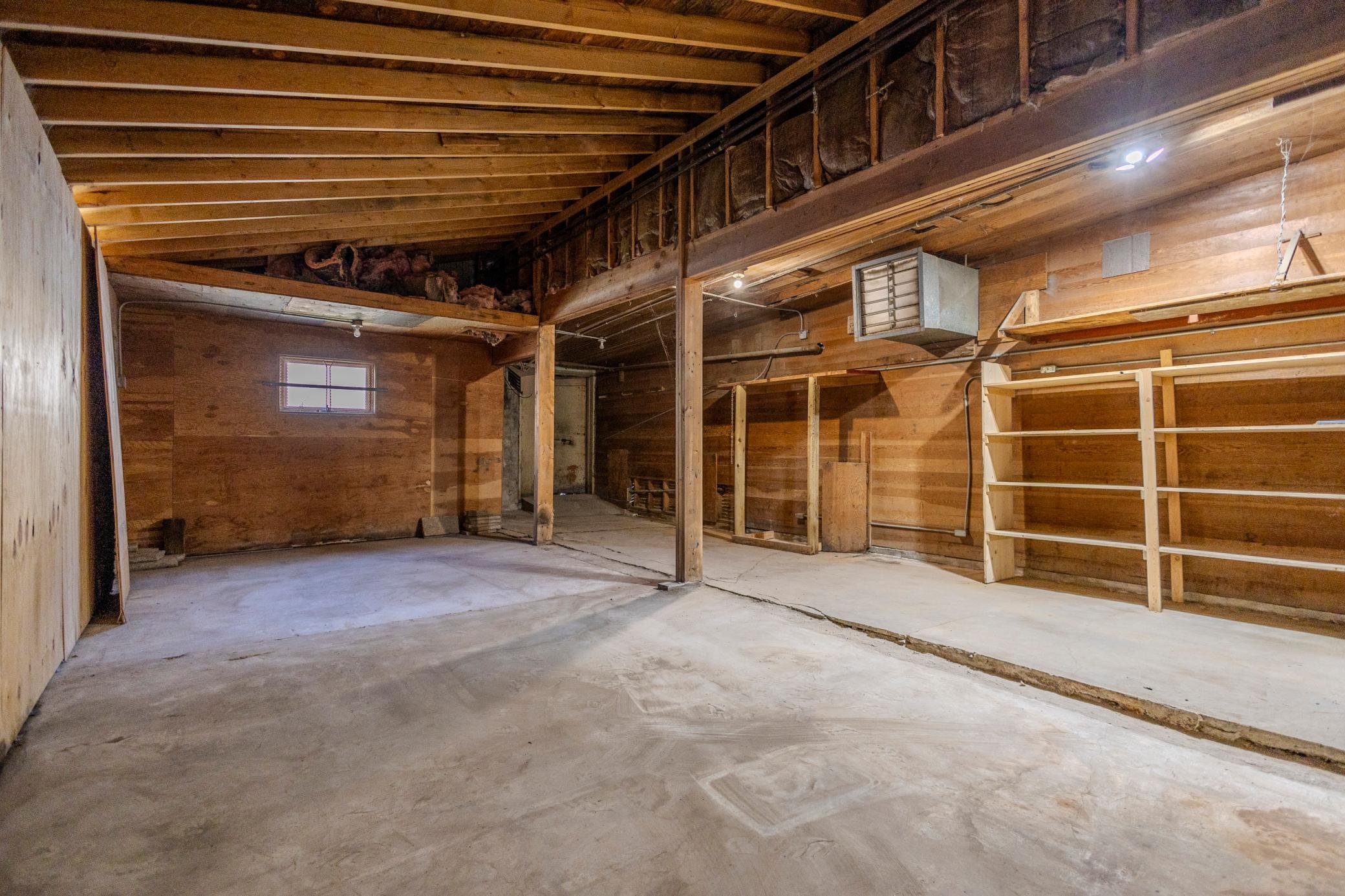 Storage / Workshop: Spacious Multi-Bay Area with Built-in Shelving & Suspended Heater