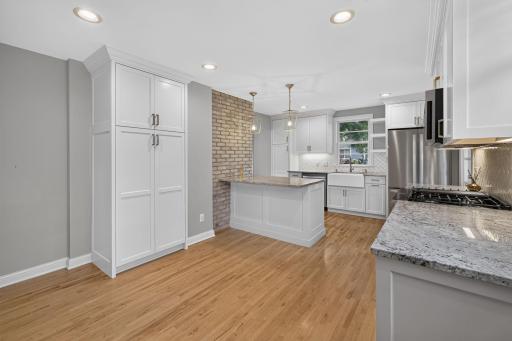 Thoughtfully updated kitchen/dining room offers excellent storage and generous workspace.