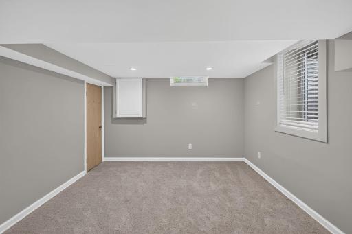 Lower-level bedroom offers flexible use as a guest room or office.