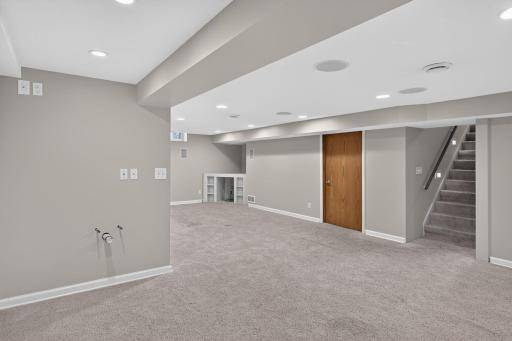 Lower level features recessed lighting throughout the family room.