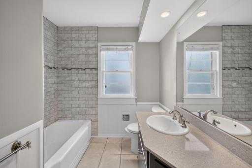 Updated full bath conveniently serves both main-level bedrooms.