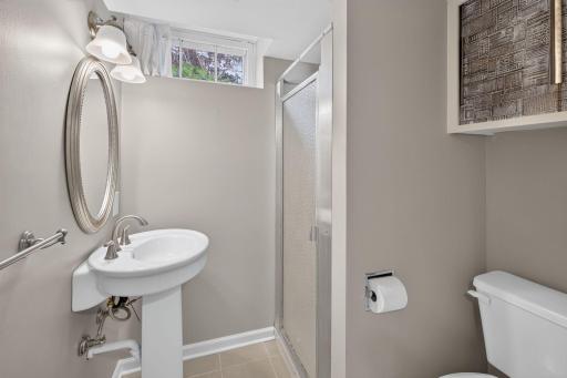 Convenient lower-level three-quarter bath with walk-in shower.