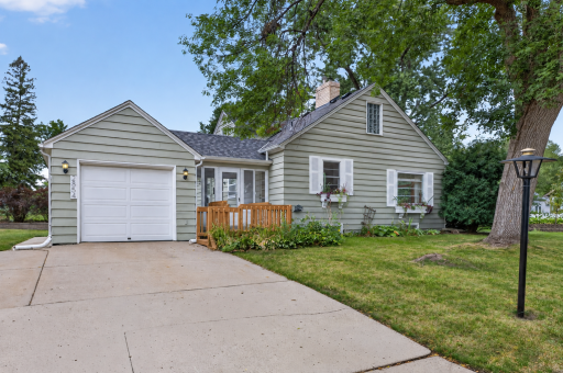 Convenient attached garage connected to the home by a breezeway. The grass has been virtually altered