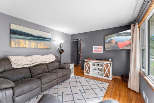 Hardwood floors bring warth and character to the welcoming living room